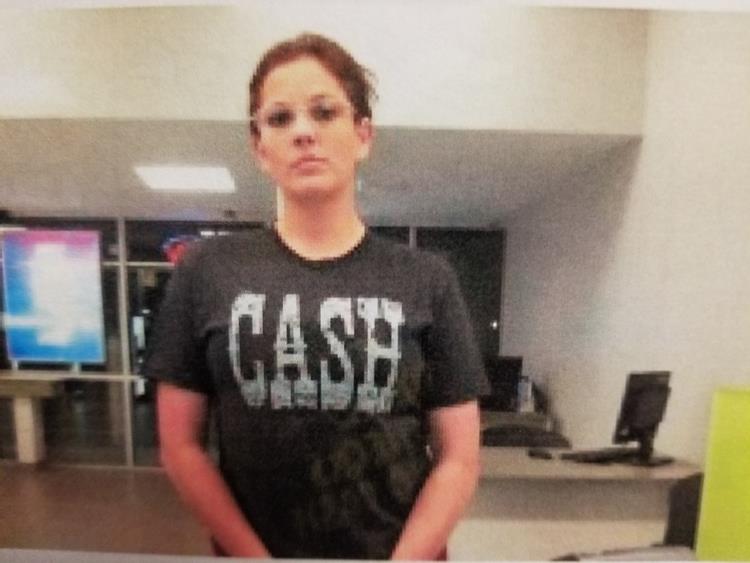 photo of suspect wearing CASH shirt